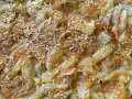 Finoçchi gratinati al forno con besciamella, dorati e croccanti, con formaggio filante e una spolverata di parmigiano.
